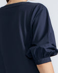 Artemisa Top in Navy – Cotton wrap top with round neckline, ¾ sleeves, and tie waist, made in Peru.