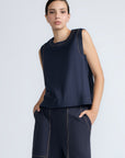 Avayah Top in Navy – 100% cotton sleeveless top with round neckline, shoulder button accents, and drawstring hem.