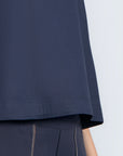 Avayah Top in Navy – 100% cotton sleeveless top with round neckline, shoulder button accents, and drawstring hem.