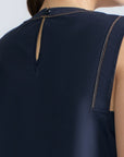 Avayah Top in Navy – 100% cotton sleeveless top with round neckline, shoulder button accents, and drawstring hem.
