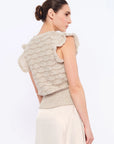 Back view of the Beca Vest, detailing the adjustable woven tie at the nape.