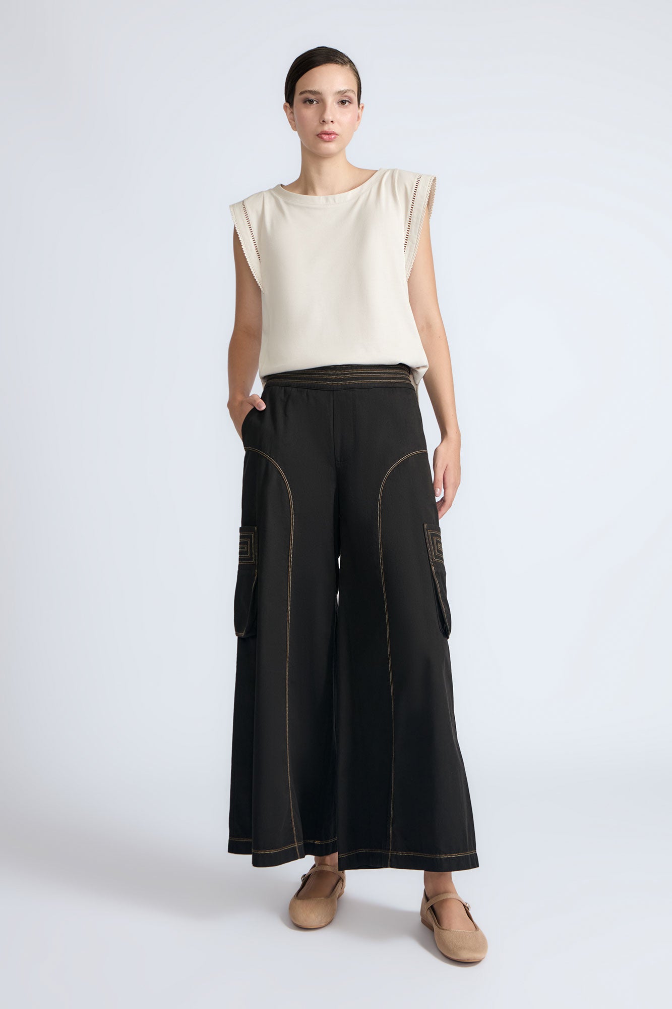 Bela Pant in Black – Cropped cotton palazzo pants with side flap pockets, elasticated waist, and contrast stitching.