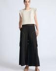 Bela Pant in Black – Cropped cotton palazzo pants with side flap pockets, elasticated waist, and contrast stitching.