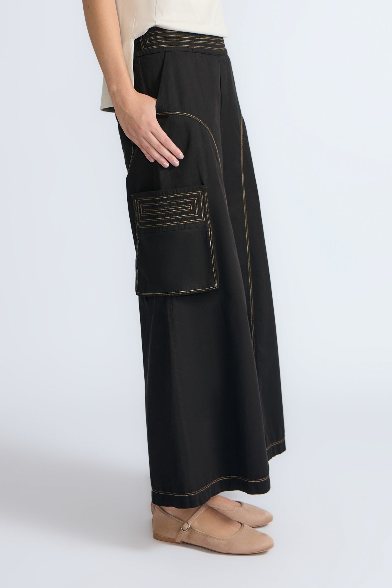 Bela Pant in Black – Cropped cotton palazzo pants with side flap pockets, elasticated waist, and contrast stitching.
