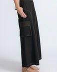 Bela Pant in Black – Cropped cotton palazzo pants with side flap pockets, elasticated waist, and contrast stitching.