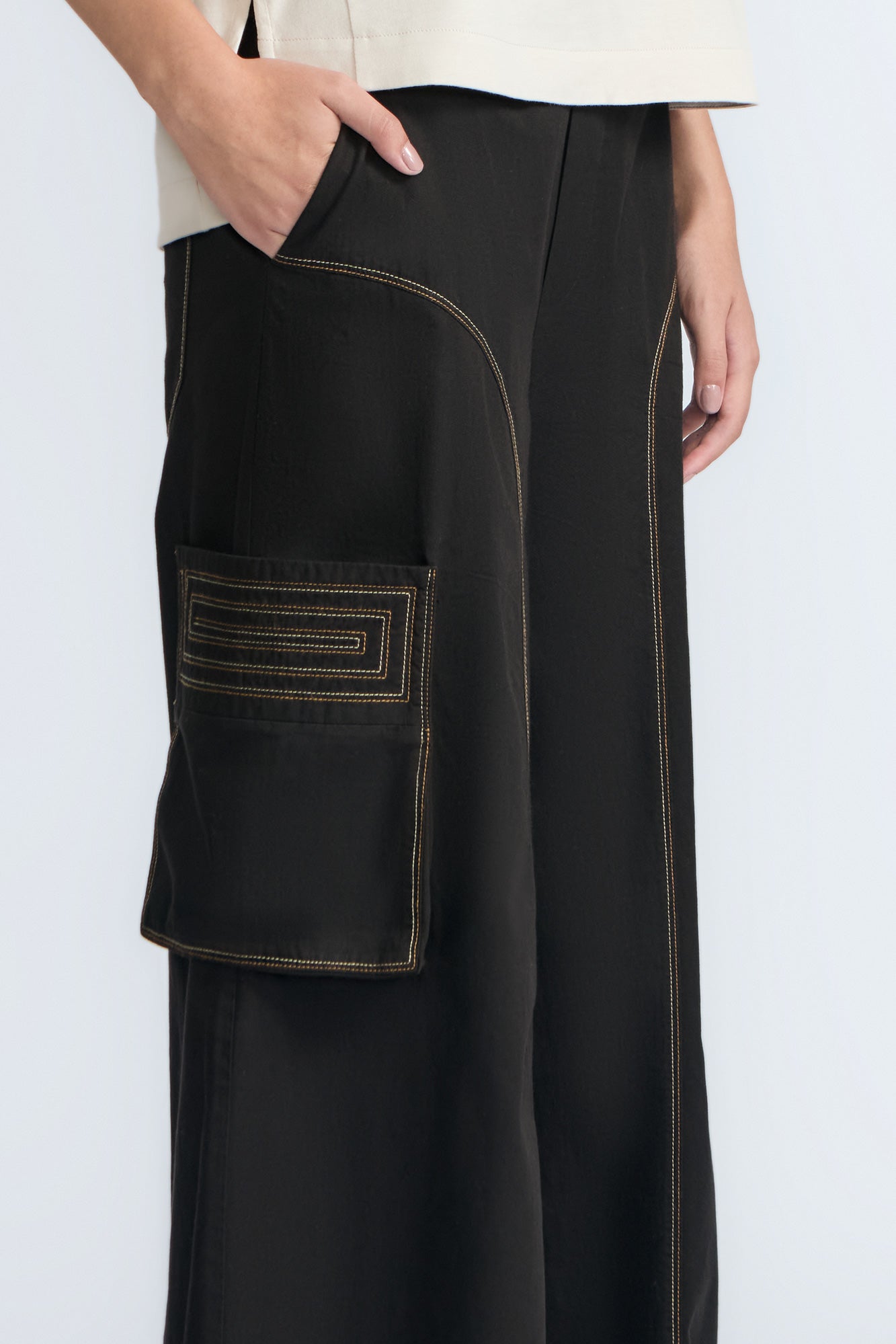 Bela Pant in Black – Cropped cotton palazzo pants with side flap pockets, elasticated waist, and contrast stitching.