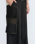 Bela Pant in Black – Cropped cotton palazzo pants with side flap pockets, elasticated waist, and contrast stitching.