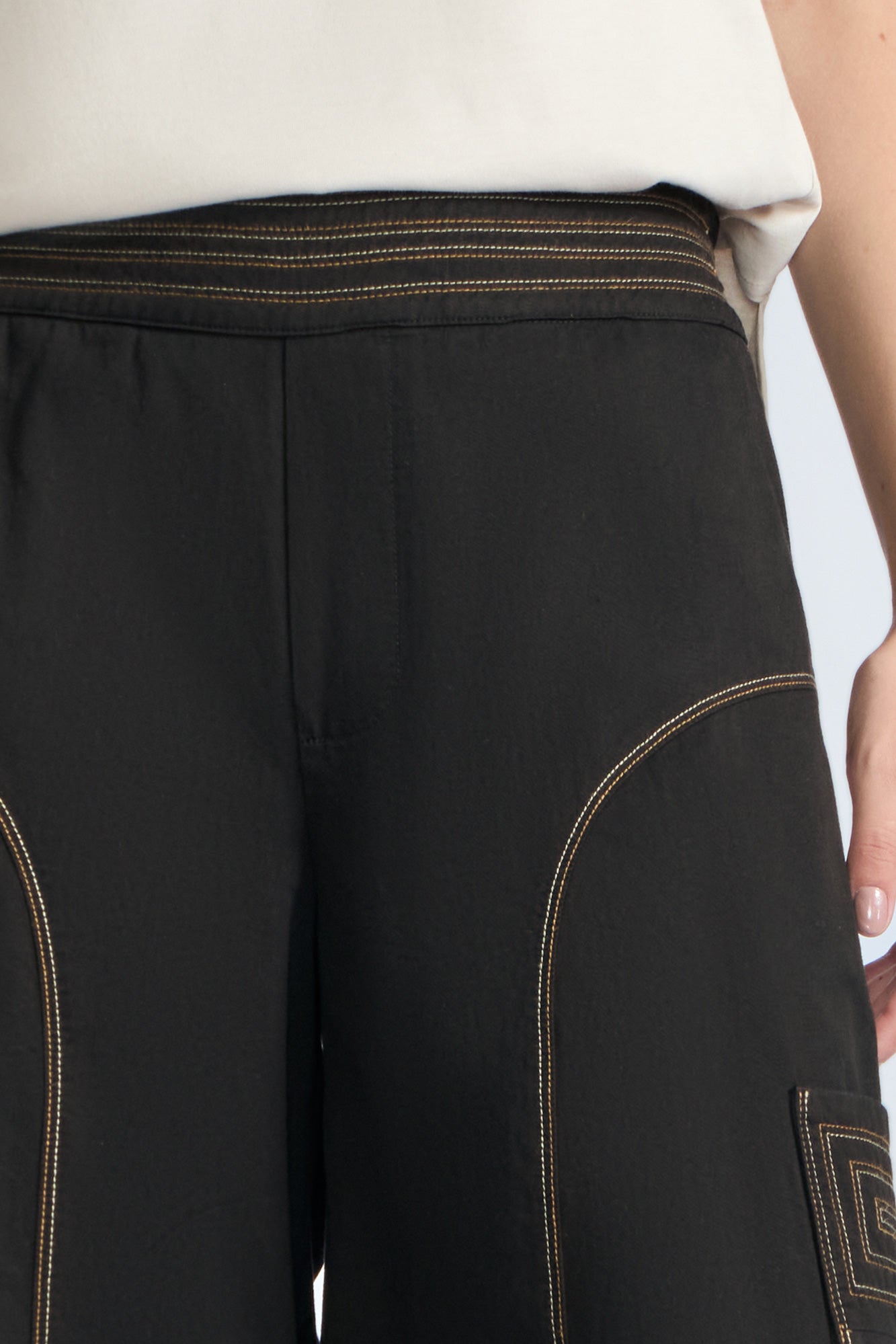 Bela Pant in Black – Cropped cotton palazzo pants with side flap pockets, elasticated waist, and contrast stitching.