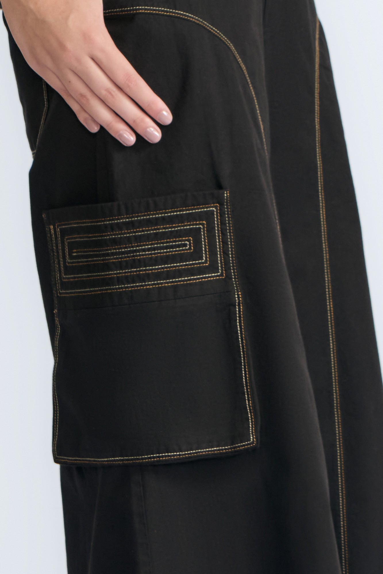 Bela Pant in Black – Cropped cotton palazzo pants with side flap pockets, elasticated waist, and contrast stitching.