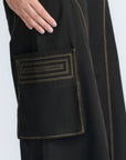 Bela Pant in Black – Cropped cotton palazzo pants with side flap pockets, elasticated waist, and contrast stitching.