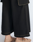 Bela Pant in Black – Cropped cotton palazzo pants with side flap pockets, elasticated waist, and contrast stitching.