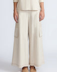 Bela Pant in Prestine – Cropped cotton palazzo pants with side flap pockets, elasticated waist, and contrast stitching.