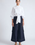 Belen Pant in Navy – Cotton palazzo trousers with side patch pockets, metal buckle details, and a wide waistband.