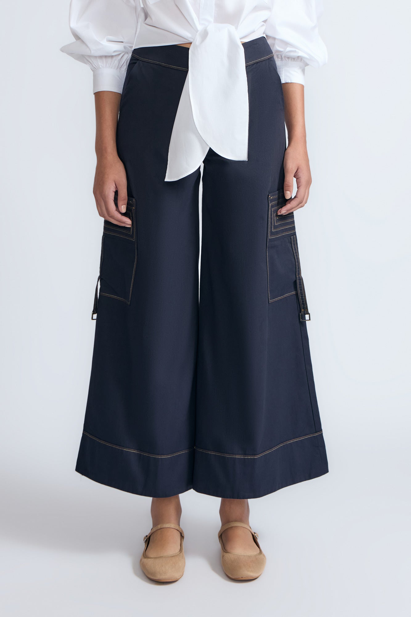 Belen Pant in Navy – Cotton palazzo trousers with side patch pockets, metal buckle details, and a wide waistband.