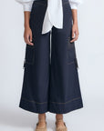 Belen Pant in Navy – Cotton palazzo trousers with side patch pockets, metal buckle details, and a wide waistband.