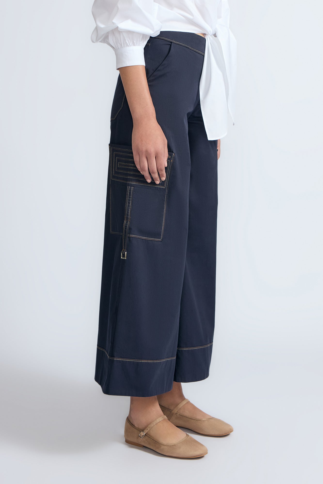 Belen Pant in Navy – Cotton palazzo trousers with side patch pockets, metal buckle details, and a wide waistband.