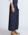 Belen Pant in Navy – Cotton palazzo trousers with side patch pockets, metal buckle details, and a wide waistband.