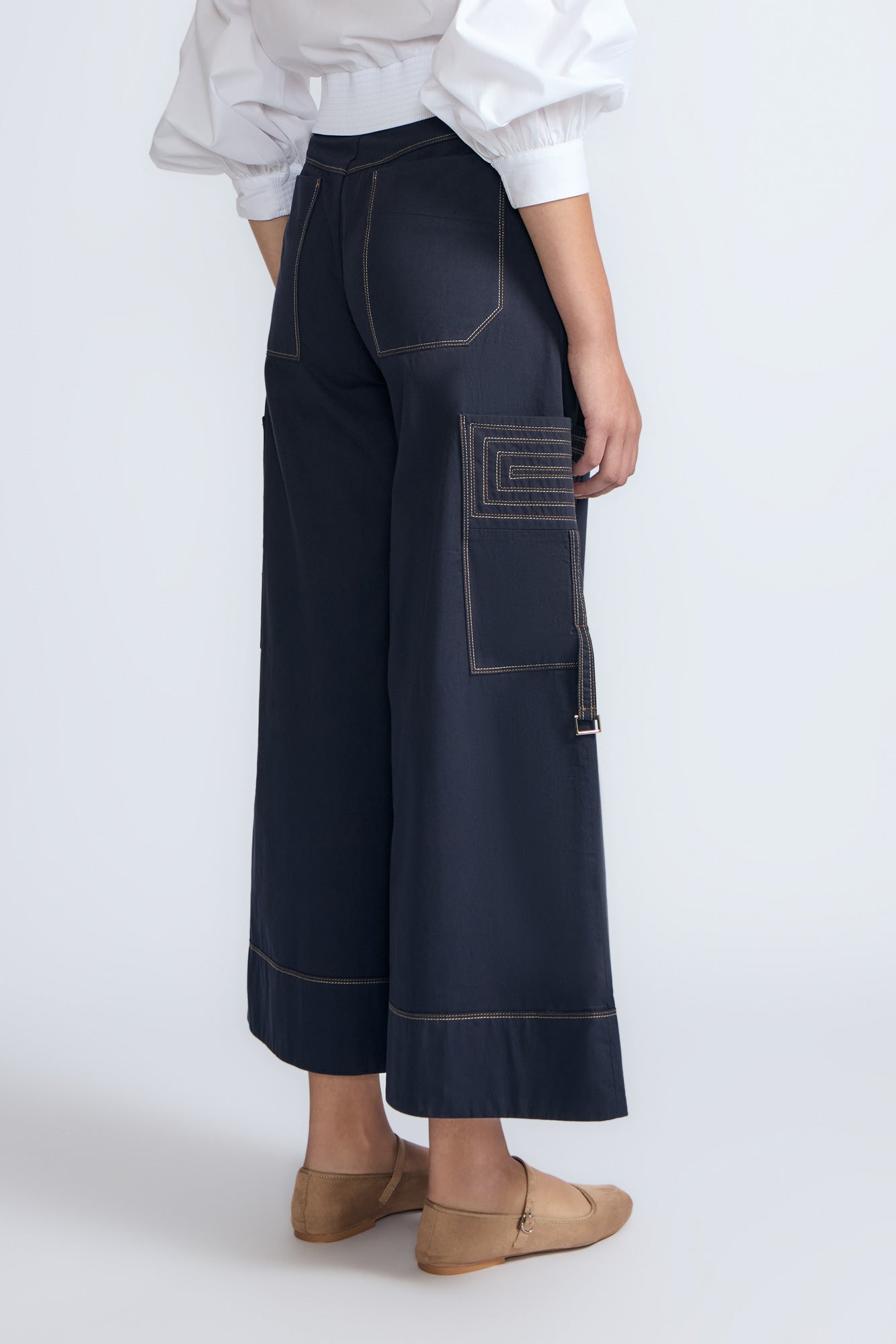Belen Pant in Navy – Cotton palazzo trousers with side patch pockets, metal buckle details, and a wide waistband.