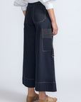 Belen Pant in Navy – Cotton palazzo trousers with side patch pockets, metal buckle details, and a wide waistband.
