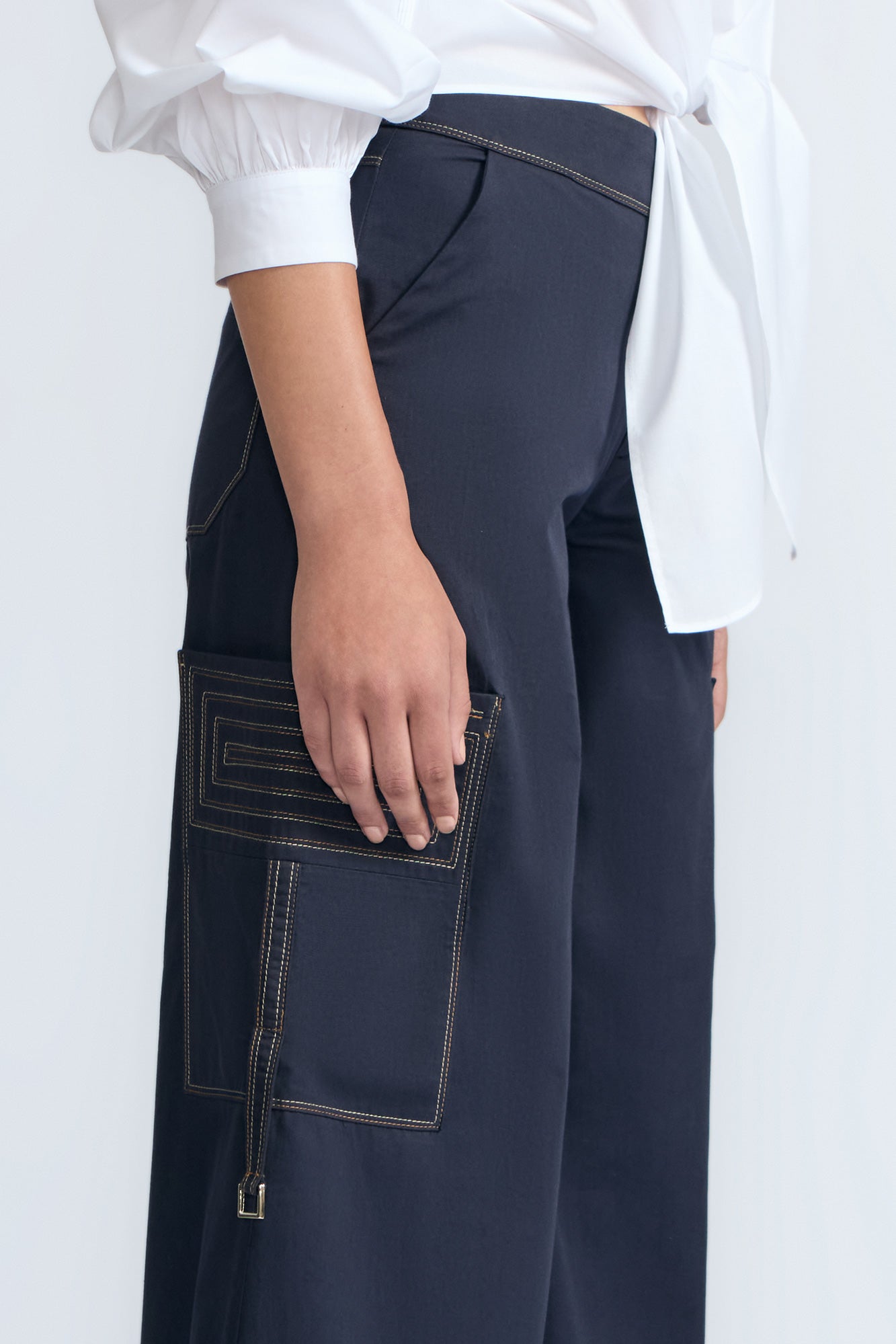 Belen Pant in Navy – Cotton palazzo trousers with side patch pockets, metal buckle details, and a wide waistband.