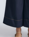 Belen Pant in Navy – Cotton palazzo trousers with side patch pockets, metal buckle details, and a wide waistband.