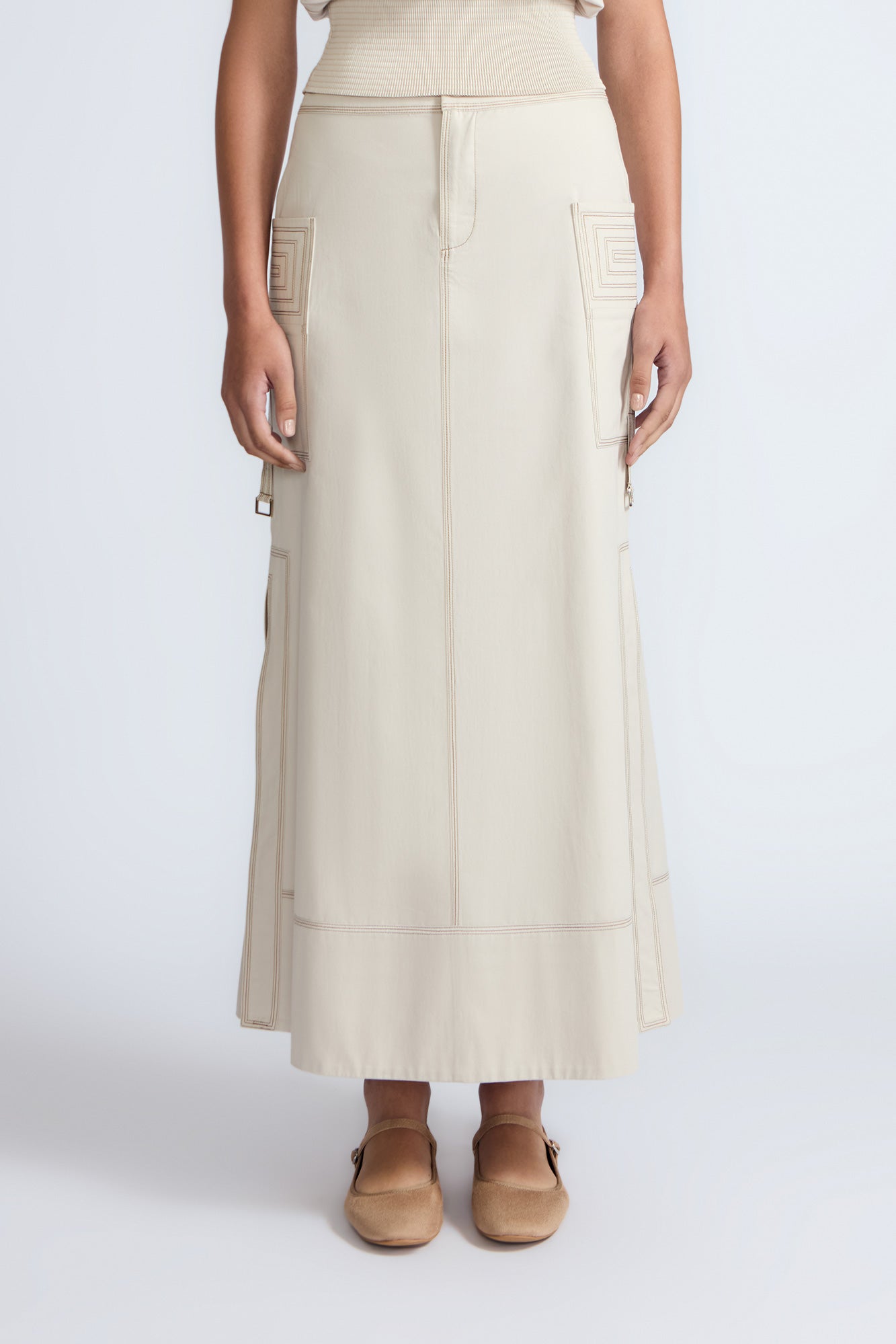 Belen Skirt in Prestine – Cotton maxi skirt with patch pockets, buckle straps, wide waistband, and contrast stitching.