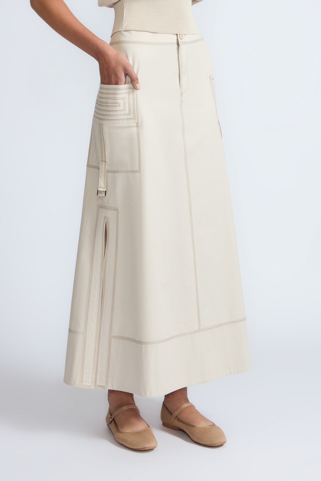 Belen Skirt in Prestine – Cotton maxi skirt with patch pockets, buckle straps, wide waistband, and contrast stitching.