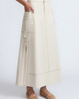 Belen Skirt in Prestine – Cotton maxi skirt with patch pockets, buckle straps, wide waistband, and contrast stitching.