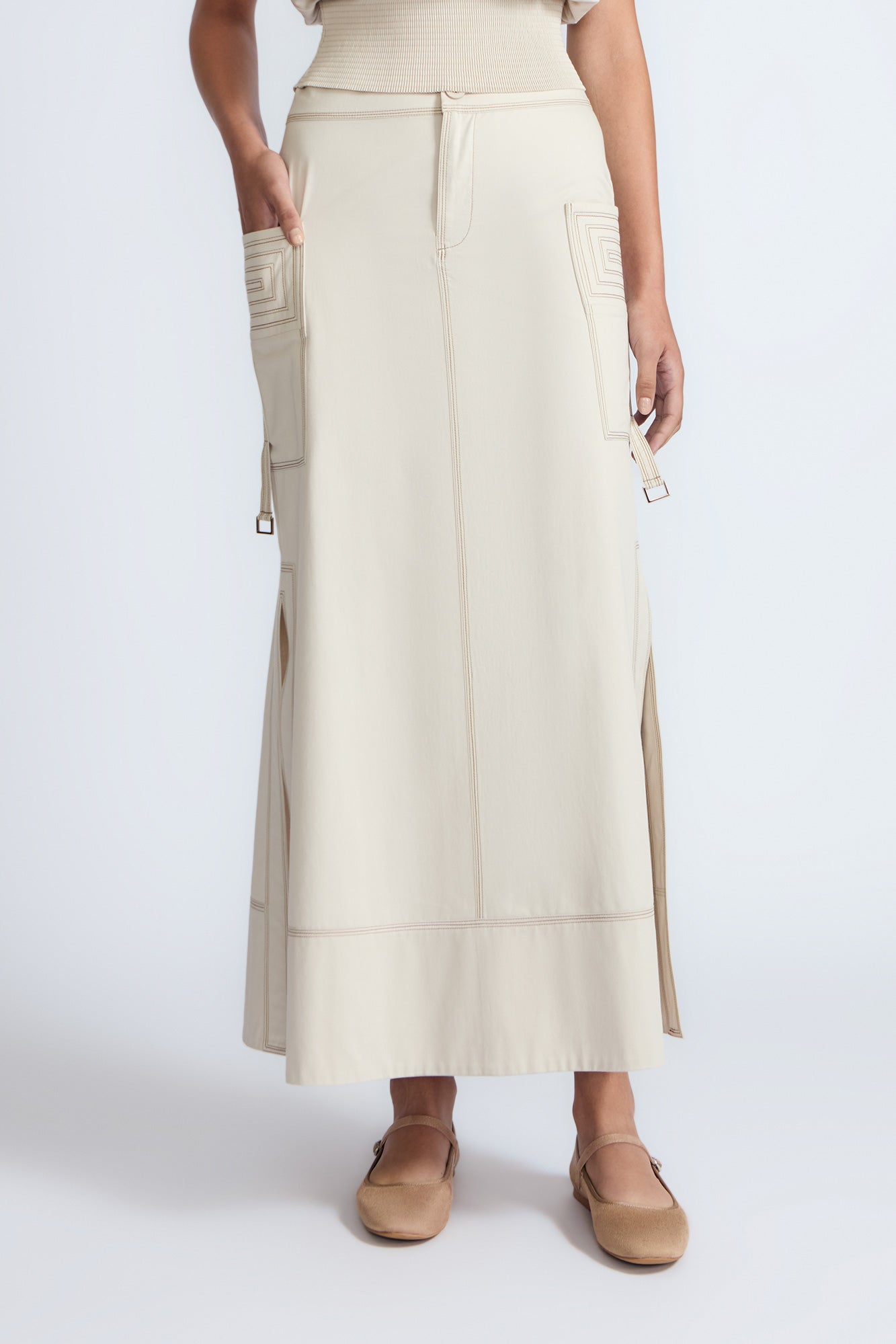Belen Skirt in Prestine – Cotton maxi skirt with patch pockets, buckle straps, wide waistband, and contrast stitching.