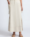 Belen Skirt in Prestine – Cotton maxi skirt with patch pockets, buckle straps, wide waistband, and contrast stitching.