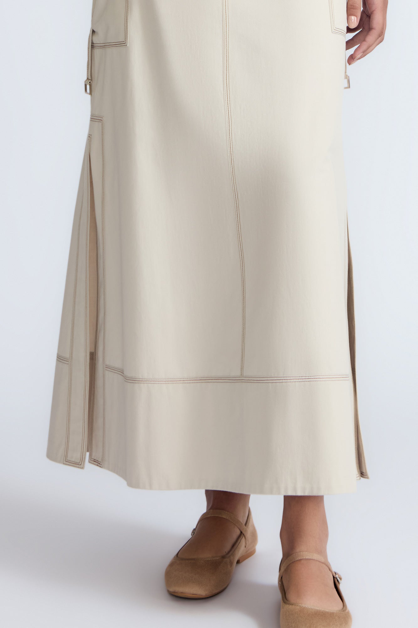 Belen Skirt in Prestine – Cotton maxi skirt with patch pockets, buckle straps, wide waistband, and contrast stitching.