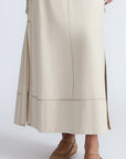 Belen Skirt in Prestine – Cotton maxi skirt with patch pockets, buckle straps, wide waistband, and contrast stitching.