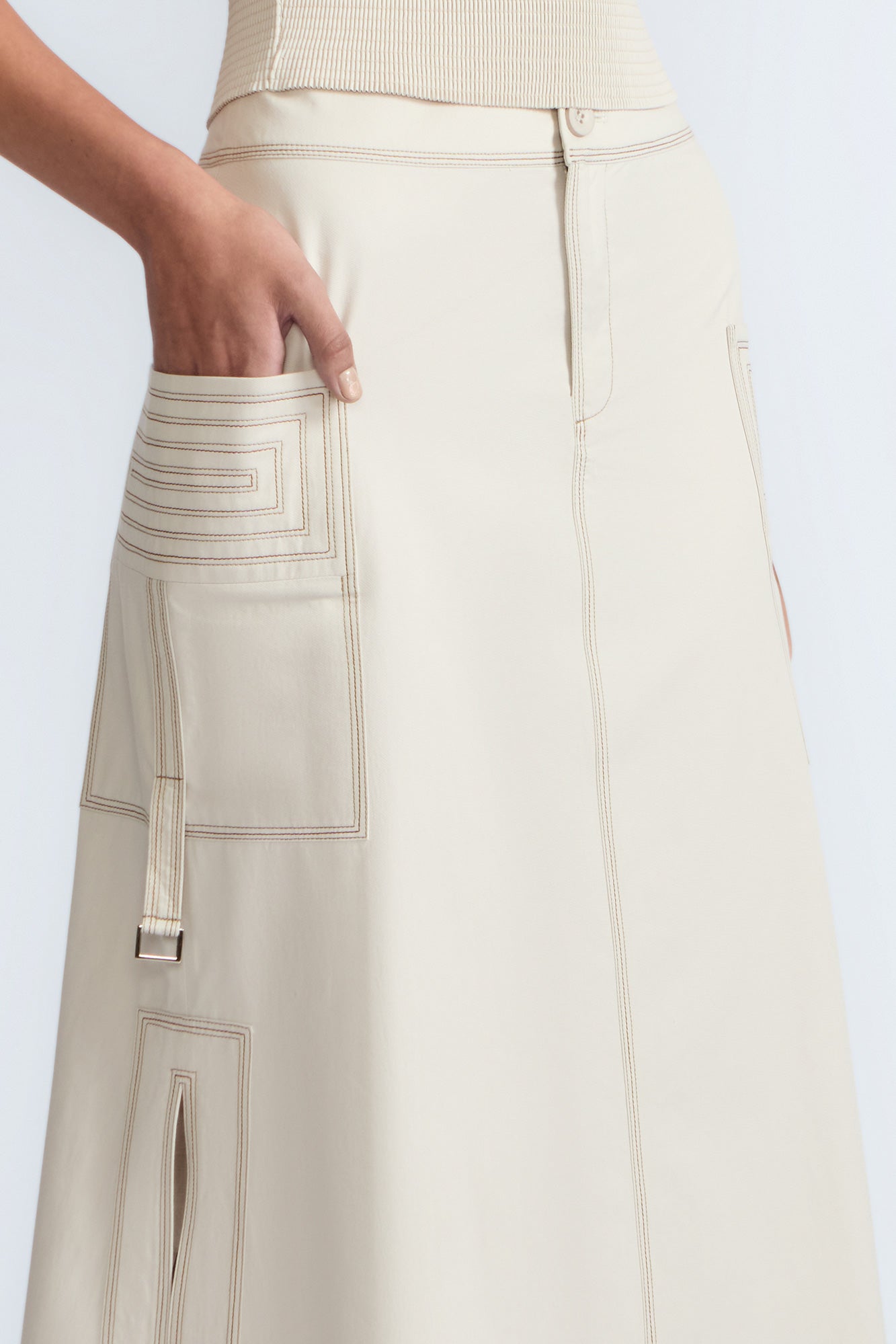 Belen Skirt in Prestine – Cotton maxi skirt with patch pockets, buckle straps, wide waistband, and contrast stitching.