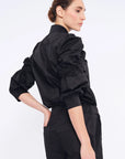 Clean back silhouette of the Bimba Blouse, crafted from premium stretch cotton.