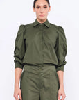 Front view of the Bimba Blouse in Olive, showcasing its classic shirt collar and relaxed silhouette.