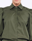 Front view of the Bimba Blouse in Olive, showcasing its classic shirt collar and relaxed silhouette.