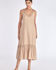 The Blake Maxi Dress in a sophisticated Nude, highlighting its romantic ruffle neckline.