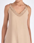 The Blake Maxi Dress in a sophisticated Nude, highlighting its romantic ruffle neckline.
