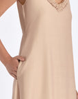 Close-up of the soft ruffle detailing and premium linen blend fabric on the Nude Blake Dress.