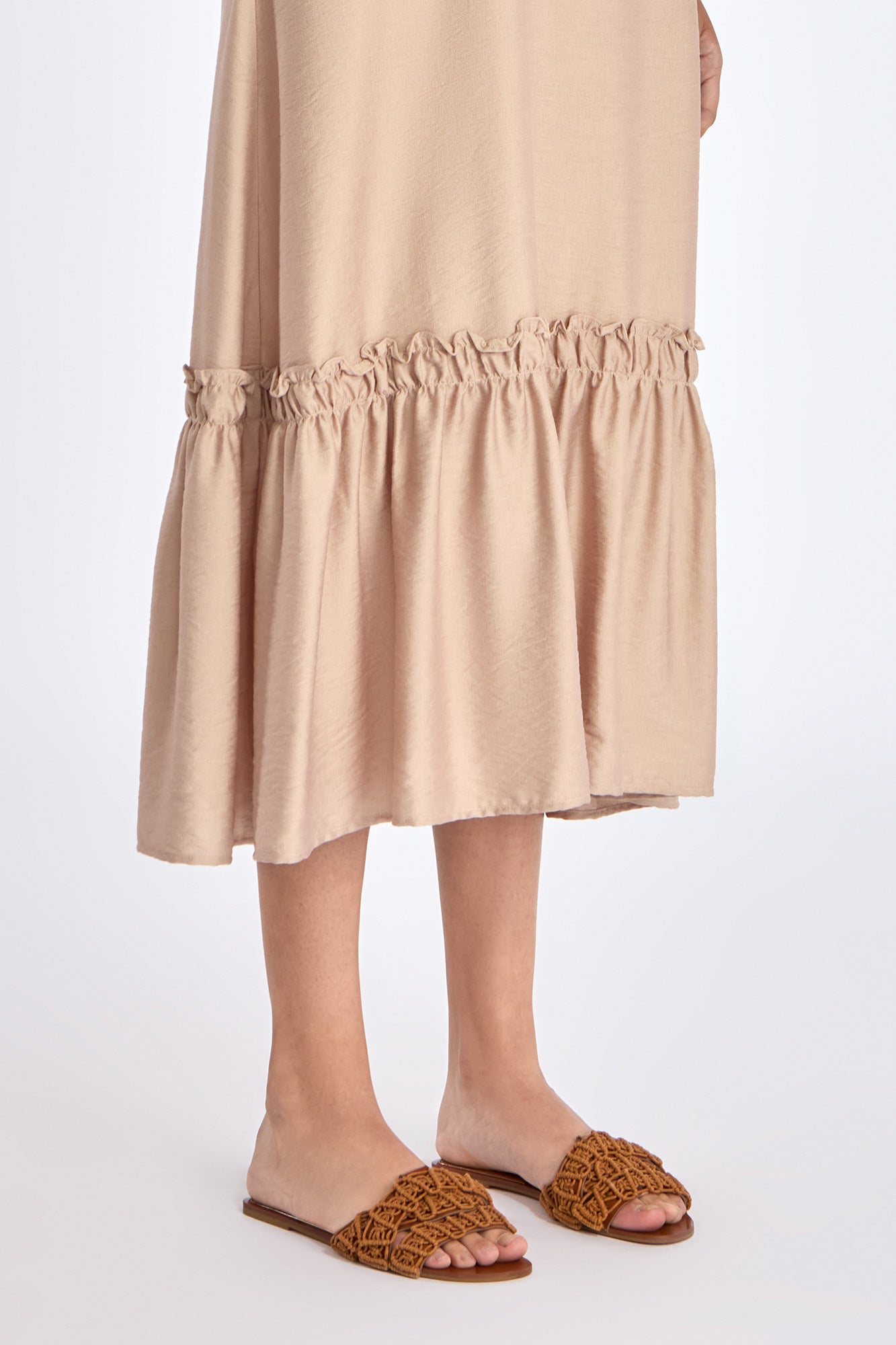 Close-up of the soft ruffle detailing and premium linen blend fabric on the Nude Blake Dress.