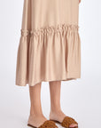 Close-up of the soft ruffle detailing and premium linen blend fabric on the Nude Blake Dress.