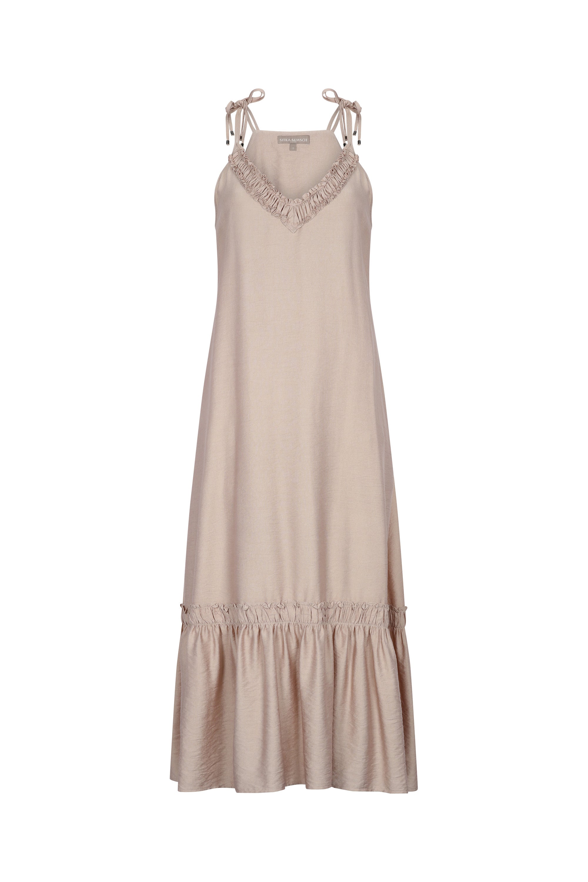 The Blake Maxi Dress in a sophisticated Nude, highlighting its romantic ruffle neckline.