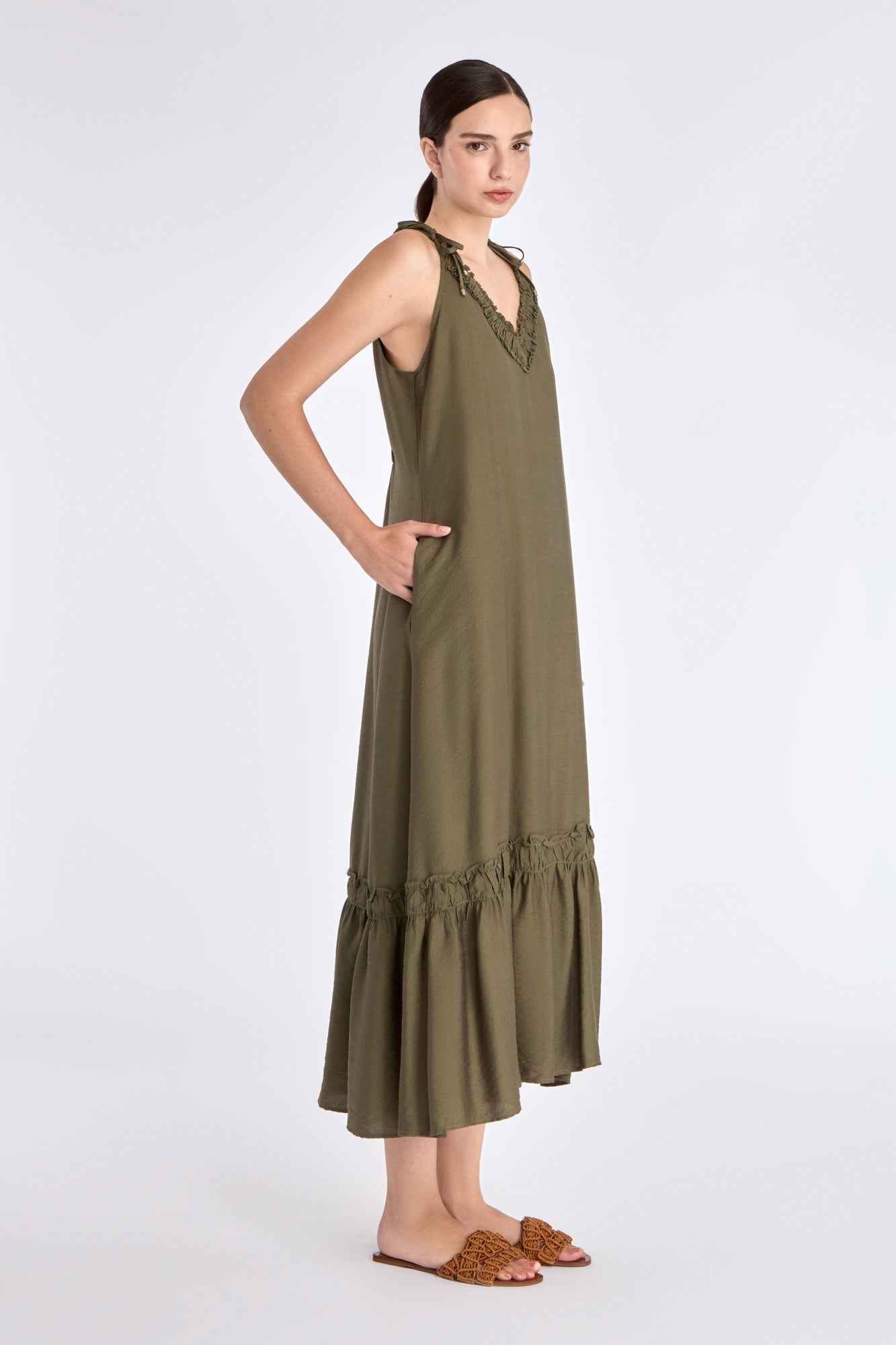 ide profile of the Olive Blake Dress, highlighting the fluid drape of the linen blend fabric.