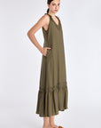 ide profile of the Olive Blake Dress, highlighting the fluid drape of the linen blend fabric.