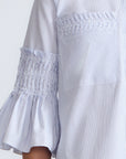 Callie Blouse – 100% cotton shirt blouse with hidden buttons, ¾ sleeves, and smocked cuffs and pockets. Made in Peru.