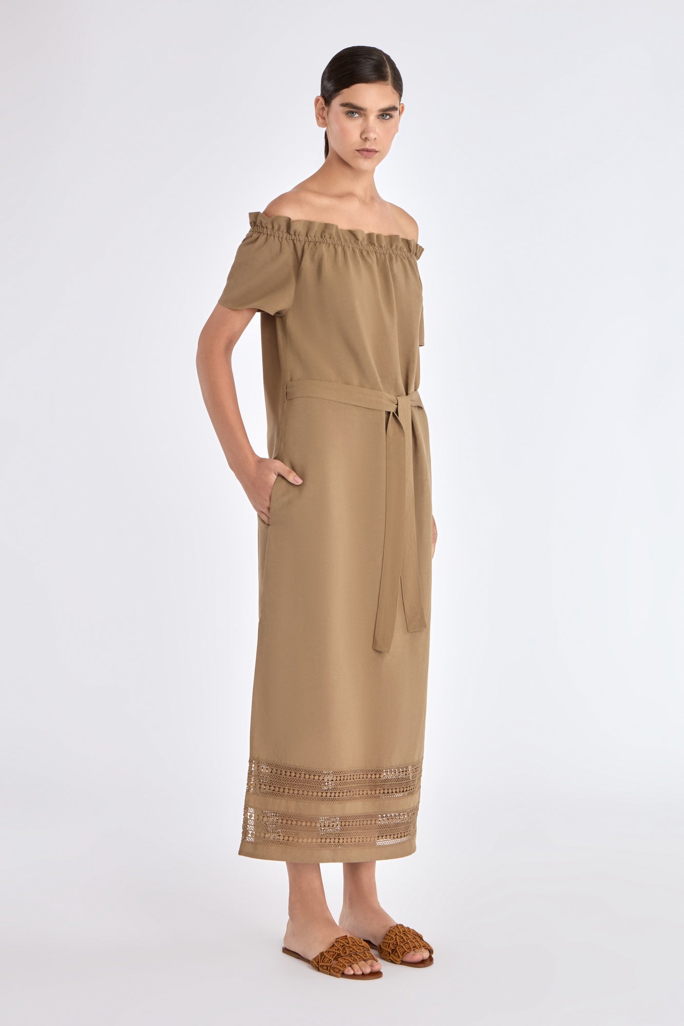 Side profile of the Taupe Cameron Dress, highlighting the fluid drape of the premium linen blend.