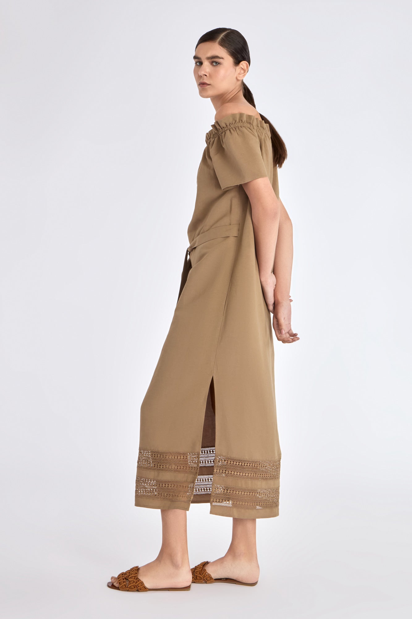 Side profile of the Taupe Cameron Dress, highlighting the fluid drape of the premium linen blend.