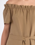 Close-up of the exquisite, handcrafted AMEDBAM embroidery on the hem of the Taupe Cameron Dress.