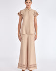 The Clark Blouse in a sophisticated Nude, featuring its crisp shirt collar and hidden button placket.