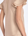 Elegant back view of the Clark Blouse in Nude.